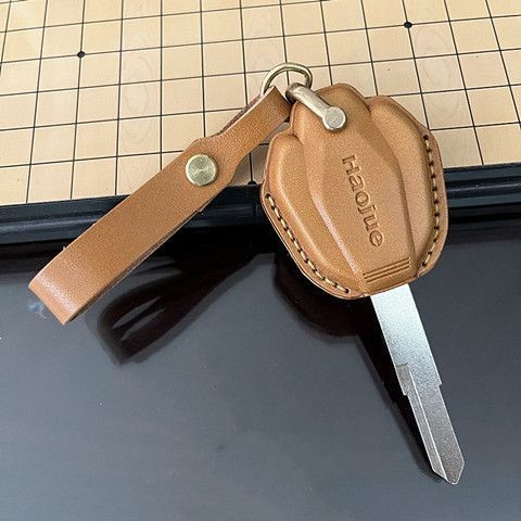 Thích hợp cho Haojue Vỏ chìa khóa xe máy XCR DR300 DR16 TR300 150 Vỏ chìa khóa da bò cổ điển thủ côn