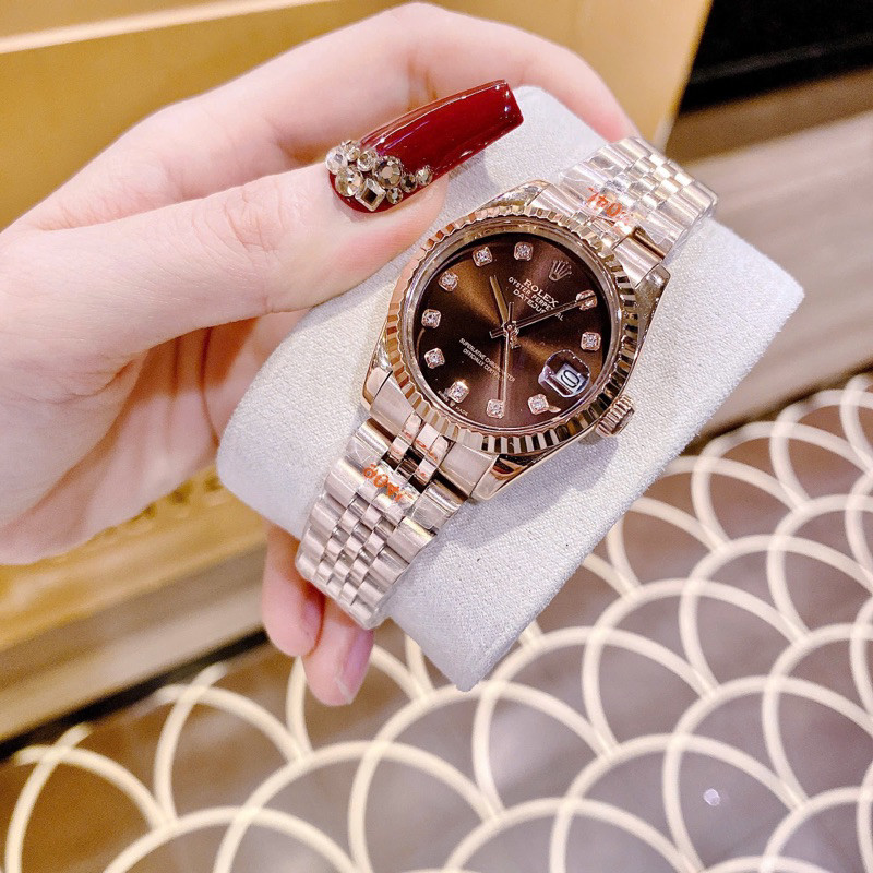 Đồng Hồ Rolexx Nữ Máy Quartz (Pin) Kính Sapphiare Mặt Tròn Siz 31mm Dây Kim Loại Rose Mặt Nâu Niềng 