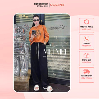 Set đồ nữ áo sweater in hình màu cam phối quần dài đen ống rộng có dây rút phong cách trẻ trung Hong Mai Tran ST15572