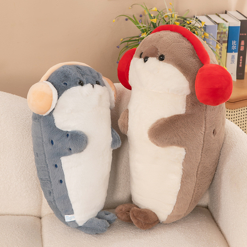 Cute seal plush toy with headphones