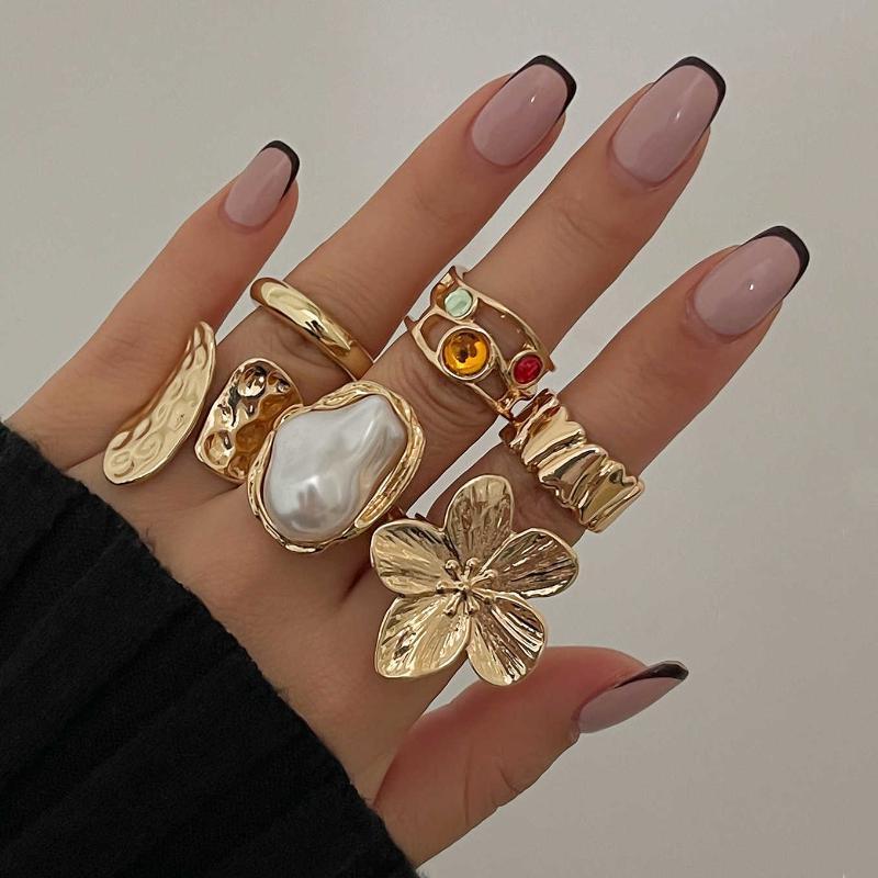 Hot-selling liquid ring set with lava-like design and floral inlay5ya Pearl rings are hot sellers in