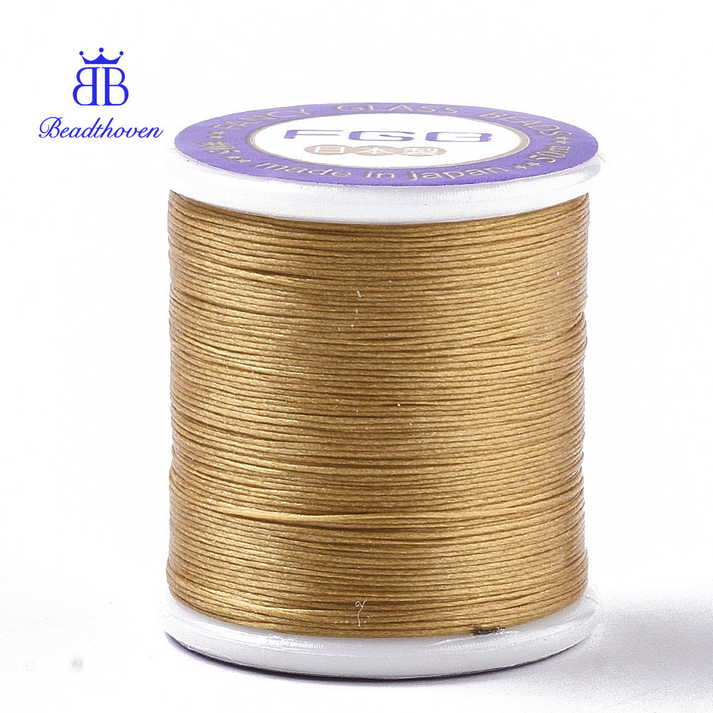 Cuộn Nylon 66 phủ hạt màu vàng kim loại, 0.1mm, 54,68 yard/cuộn (50m)