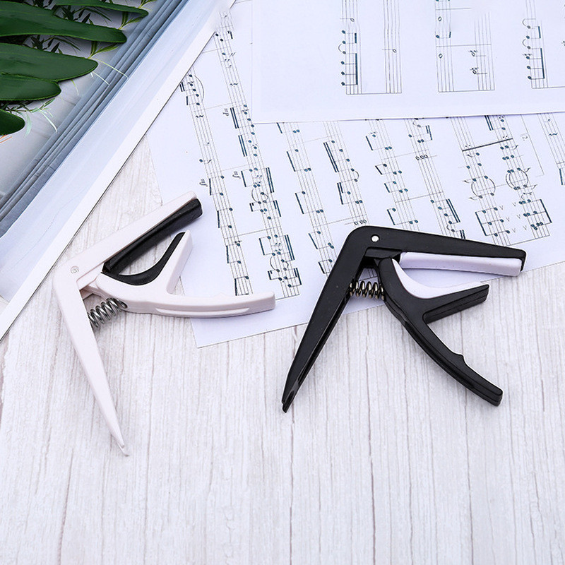 Hàng sẵn có Cung cấp đàn Guitar Acoustic Nhựa cầm tay lớn Ukulele Capo Capo Capo Capo Capo Capo Capo