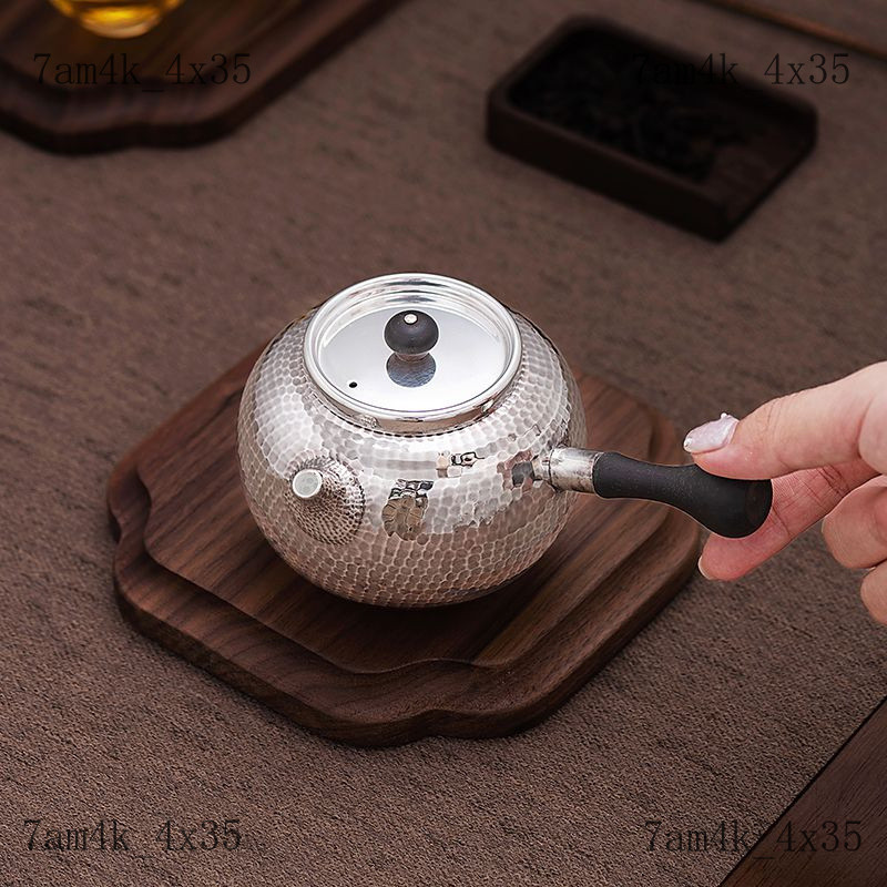 Bộ ấm tràBộ ấm tràThời đại bạc Nồi bạc999Ấm trà bạc có tay cầm bên, họa tiết chạm khắc, phong cách c