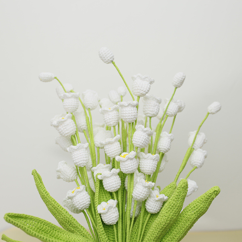 New handmade crocheted artificial flower bouquet of lily of the valley, sweet hand-knitted flowers