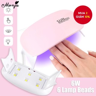 Bộ Nail Art Monja gồm sơn lót, gel UV, sơn bóng mini hồng và trắng, máy sấy LED 6W, sạc USB, công cụ làm móng.