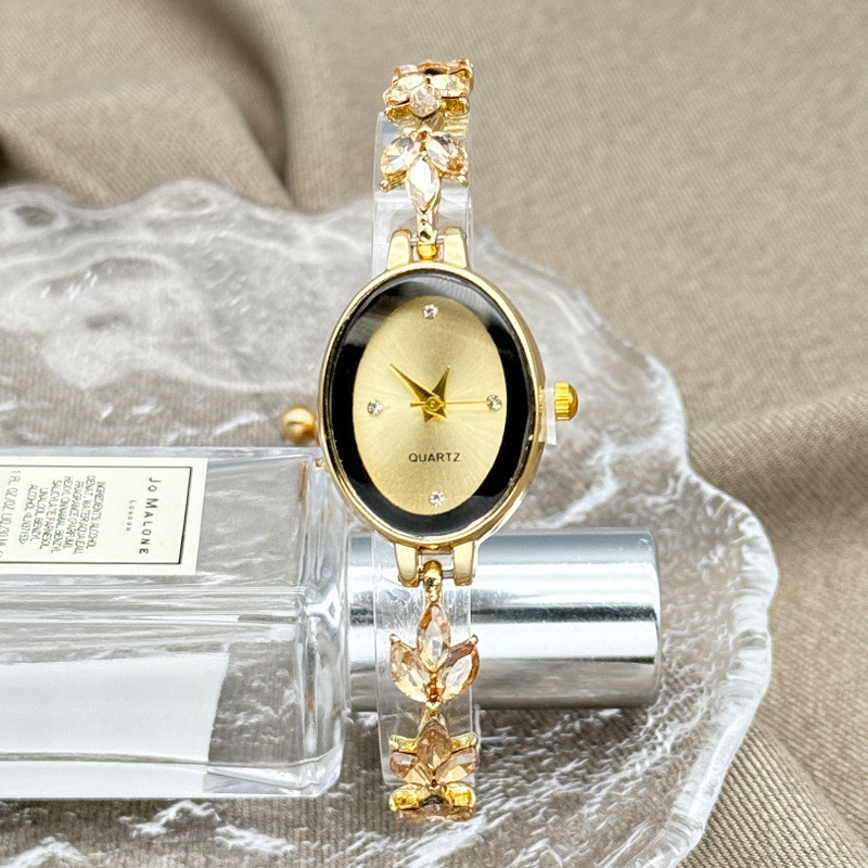 Đồng hồ nữ dây đeo hình oval cỏ bốn lá, đồng hồ quartz retro sang trọng nhẹ nhàng