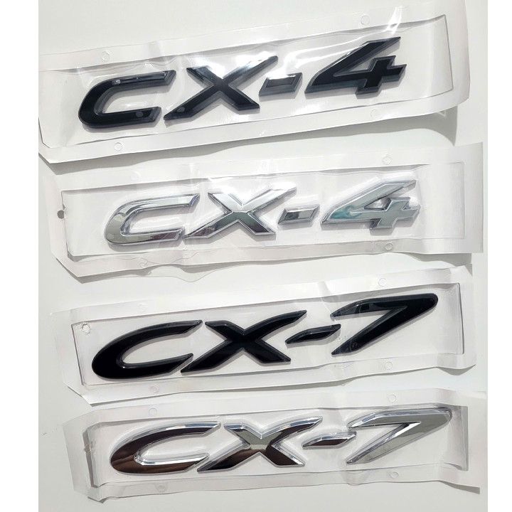 (Mazda) Keo dán chữ CX4, CX7 kèm 2 màu đen và crom cho bạn chọn. Chữ dán CX4, CX7 kèm sẵn keo.