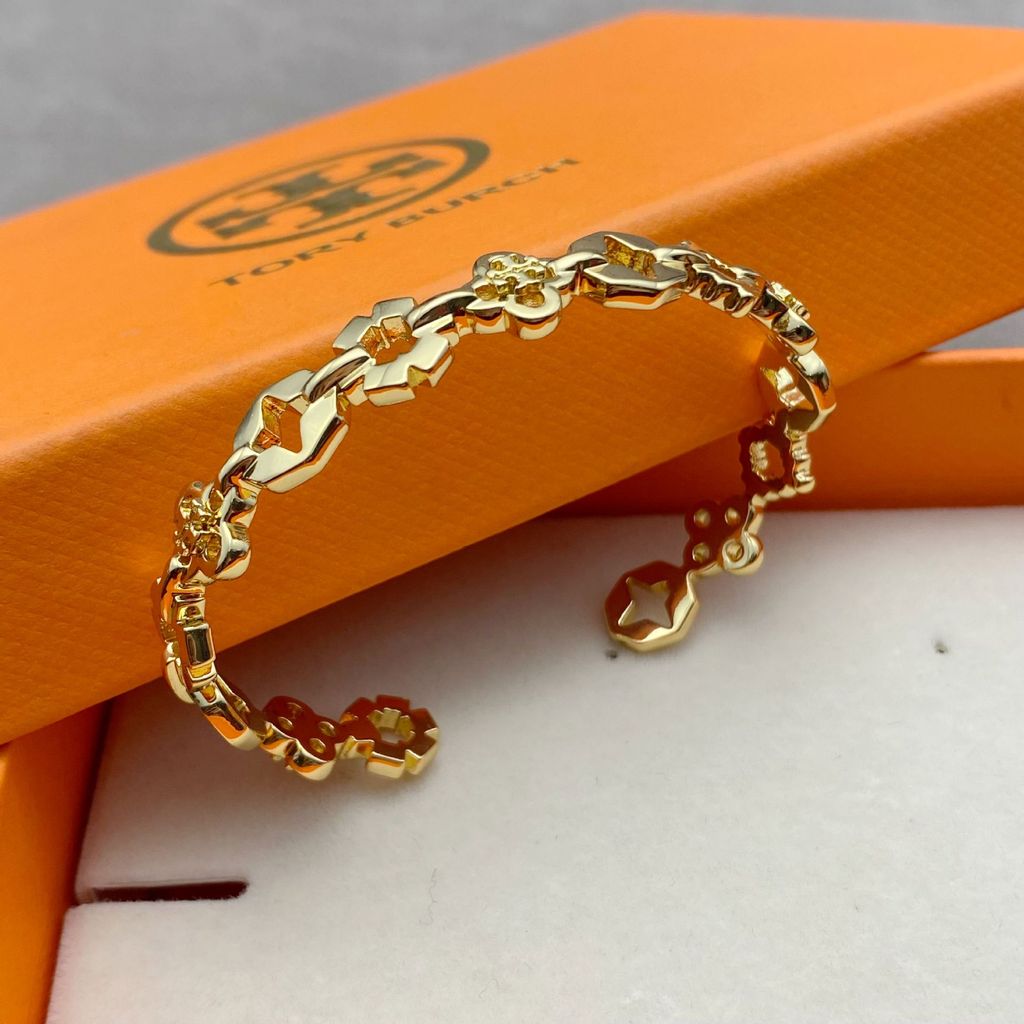 H4I1 Fashionable and minimalist cold-toned splicing design with hollow geometric four-leaf clover co
