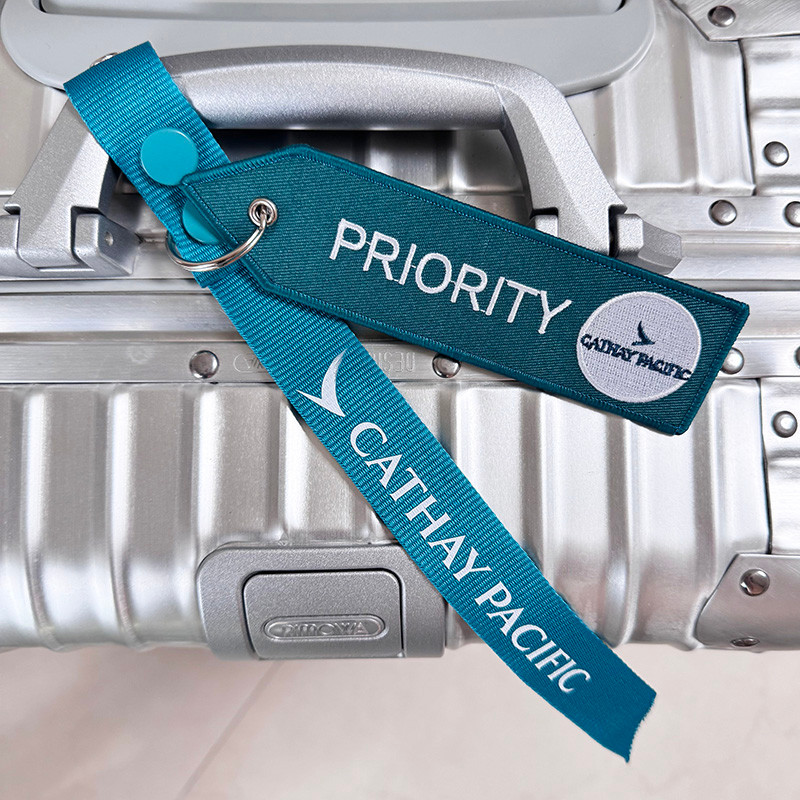 Cathay Pacific Hồng Kông Cathay Pacific Starry Sky League Tianhe Priority Pass Color Slogan Móc khóa