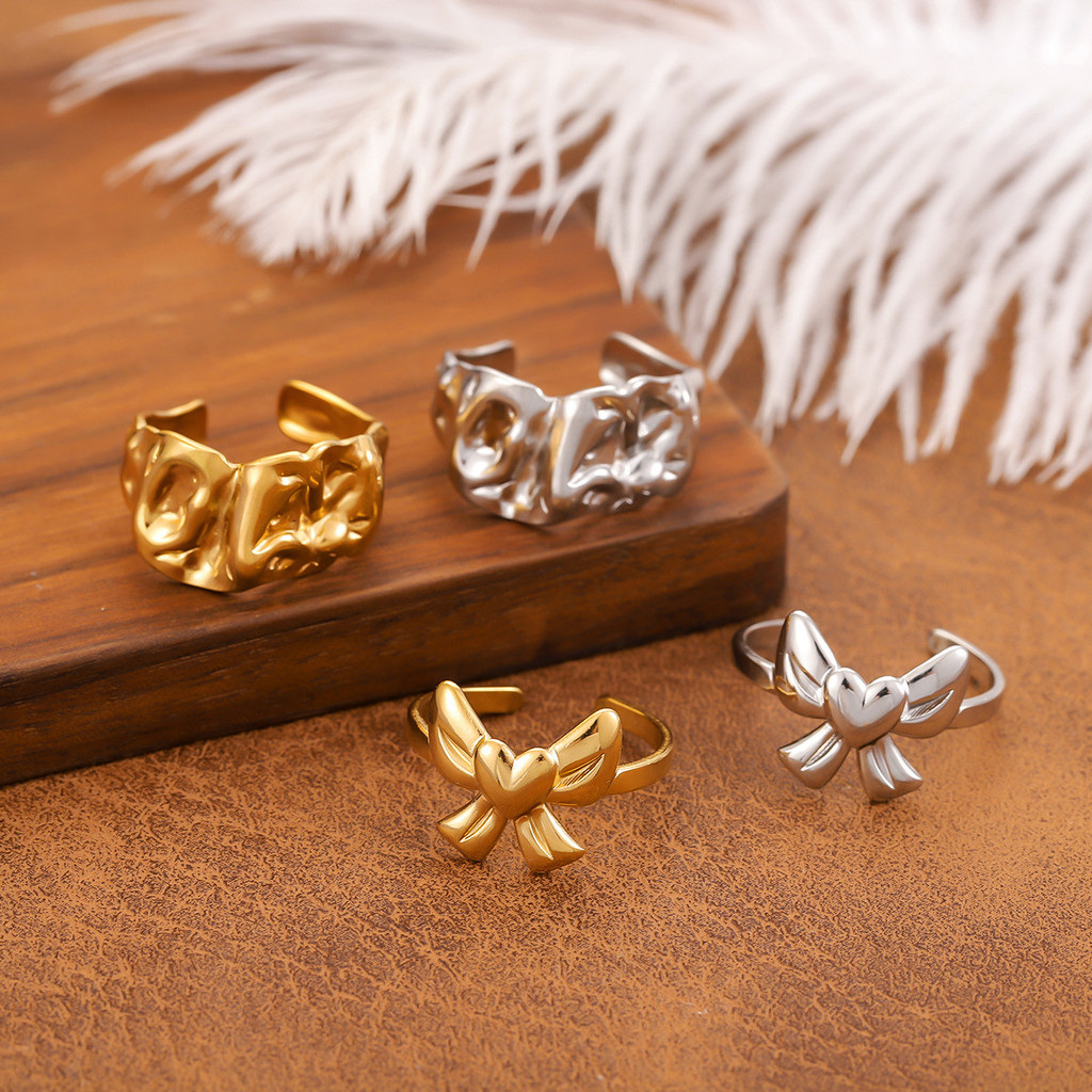 Nhẫn thép không gỉ bọc vàng 18K hình nơ tình yêu mở tay - Trang sức cát vàng WJG