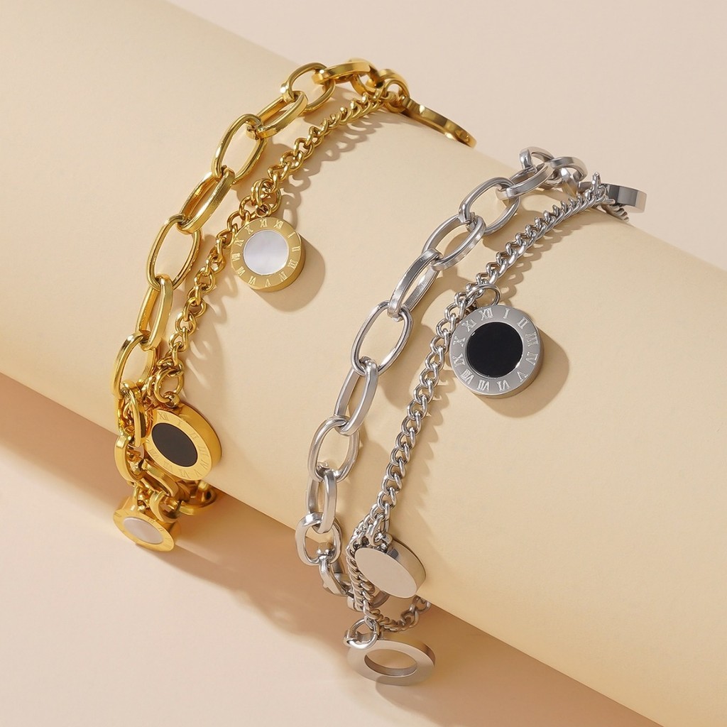 Vòng tay thép titan mạ vàng 18K hai mặt rỗng số La Mã cho bé gái