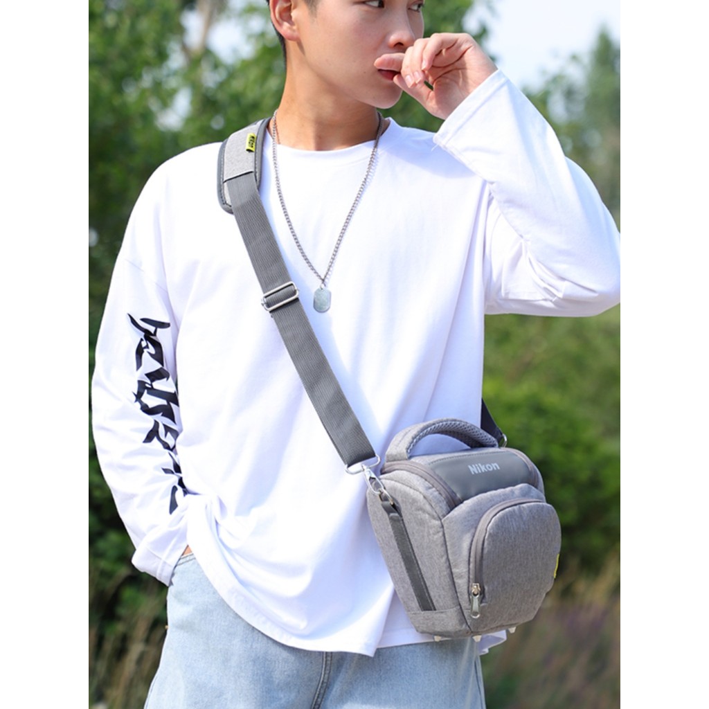 Túi đựng máy ảnh Nikon Micro Túi tam giác văn học di động đơn D7500D7000 D3500 D90 Túi đựng máy ảnh 