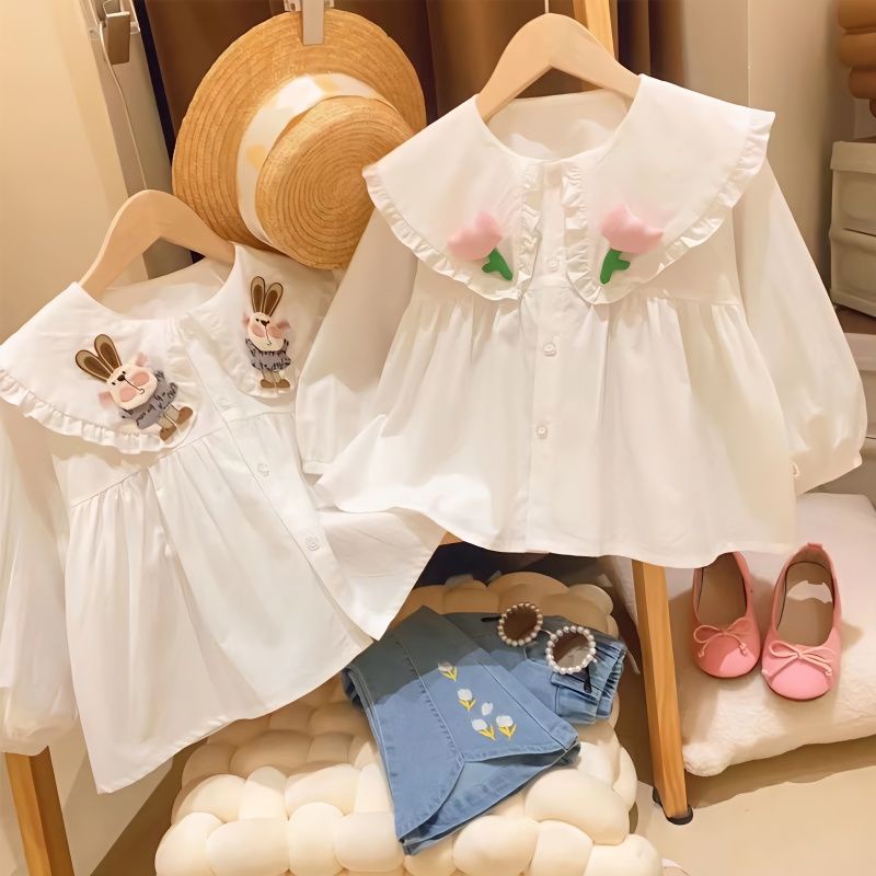 Bé gái áo sơ mi búp bê cổ áo dưới áo sơ mi bé gái phong cách hồng kông áo sơ mi trẻ em công chúa nhỏ hàng đầu