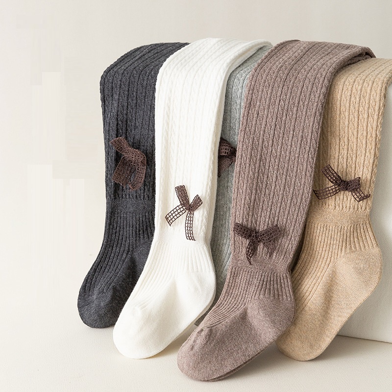 Quần tất len đính nơ cho bé gái mềm và ấm, trơn màu, co giãn 4 chiều size từ 1 đến 12 tuổi