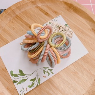 Thun cột tóc bằng nhựa lò xo giãn