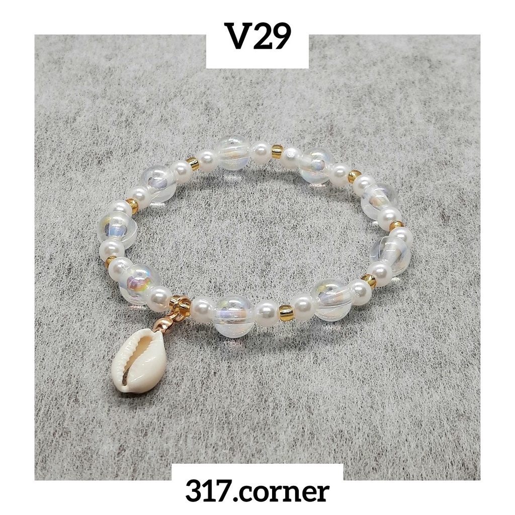 Vòng tay hạt cườm + charm vỏ sò - V29 - 317.corner