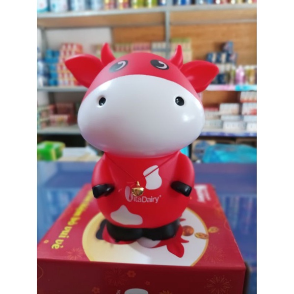 Ống heo bằng nhựa hình bò sữa ( Hàng khuyến mãi từ sữa ).