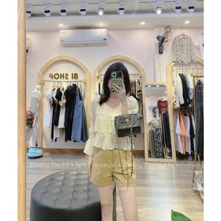 Áo sơ mi tầng cúc ngọc