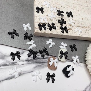 Charm nơ nhựa đen trắng đính móng sét 50 cái