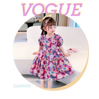 Váy hoa cúc sặc sỡ bé gái