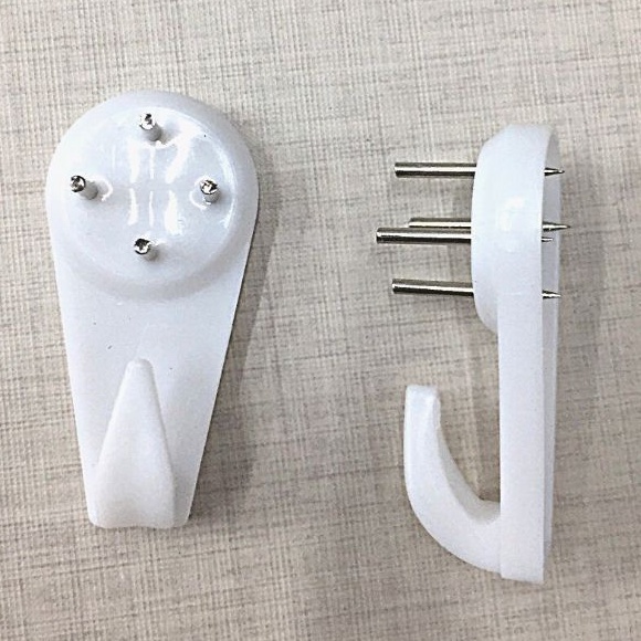 Đinh 4 chân  dùng để treo các loại đồng hồ treo tường và tranh trang trí MOD Decor