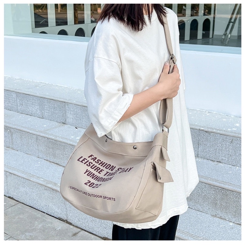 túi đeo chéo unisex,chất kaki in chữ Hongda 3 màu