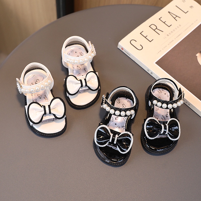 Dép Sandal Tập Đi Cho Bé Gái Chất Da Bóng Mềm Đính Nơ Ngọc Dễ Thương Cho Bé từ 1-5 tuổi