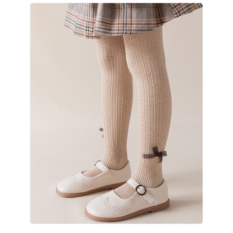 Quần tất len đính nơ cho bé gái mềm và ấm, trơn màu, co giãn 4 chiều size từ 1 đến 12 tuổi