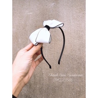 Cài tóc nơ trắng viền đen cho bé gái