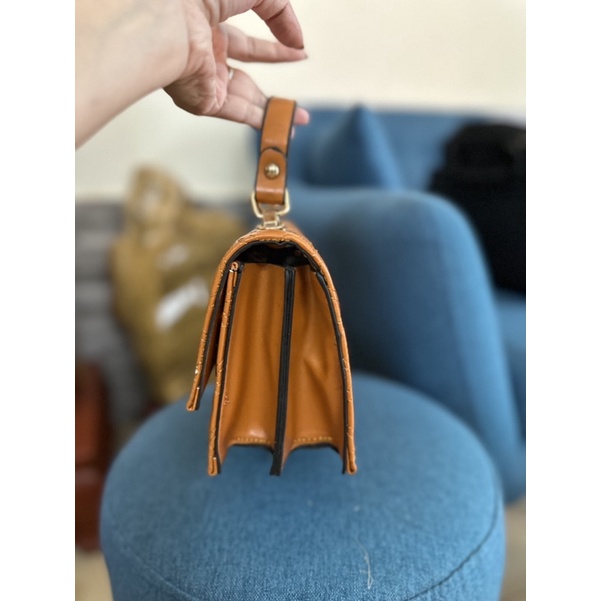 Túi xách cầm tay nữ màu nâu lỗi nhẹ