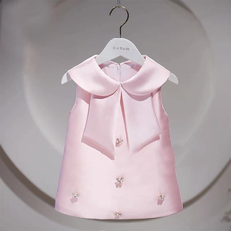 Đầm bé kết hạt trai