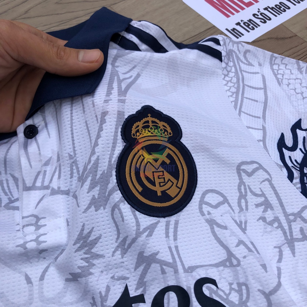 Bộ Quần Áo Bóng Đá Real Madrid Vân Rồng Vải Gai Thái Có In Tên Số Theo Yêu Cầu