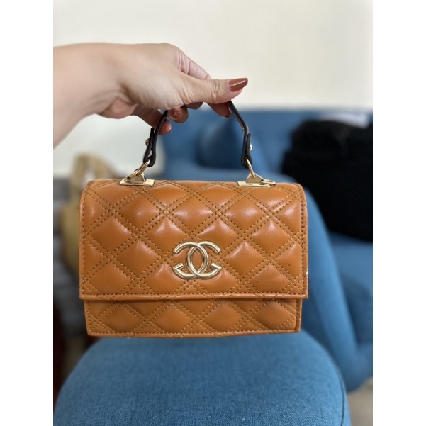 Túi xách cầm tay nữ màu nâu lỗi nhẹ