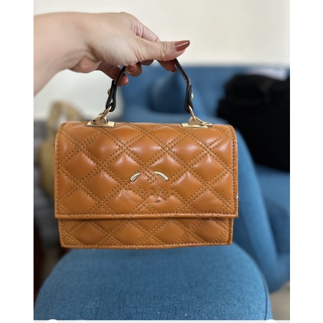 Túi xách cầm tay nữ màu nâu lỗi nhẹ