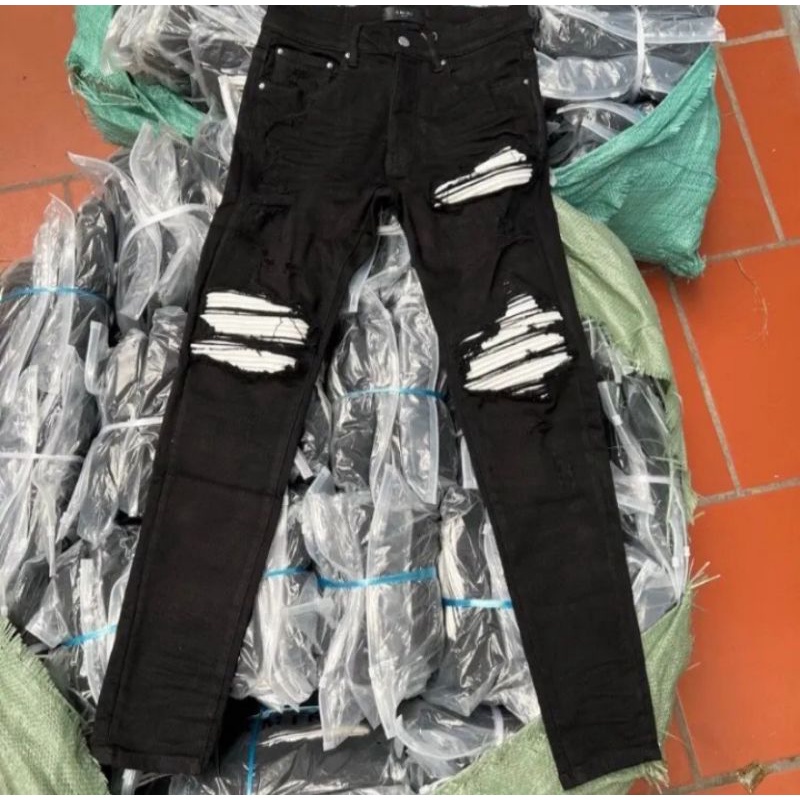 Quần jean Amiri rách gối