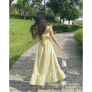 Váy midi sọc vàng cut out nơ lưng (Freesize)