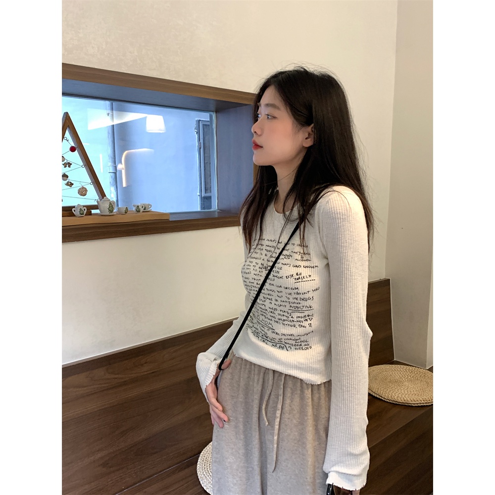 Áo thun nữ tay dài thun gân trắng in nhiều chữ đen áo form rộng/ áo ôm