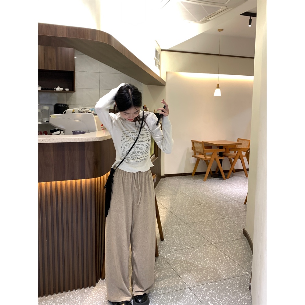 Áo thun nữ tay dài thun gân trắng in nhiều chữ đen áo form rộng/ áo ôm