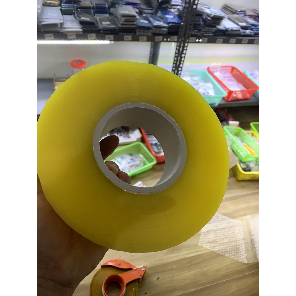 Cuộn băng dính đóng hàng đục, trong siz 5cm x 1kg ( Loại lõi mỏng - 3mm)