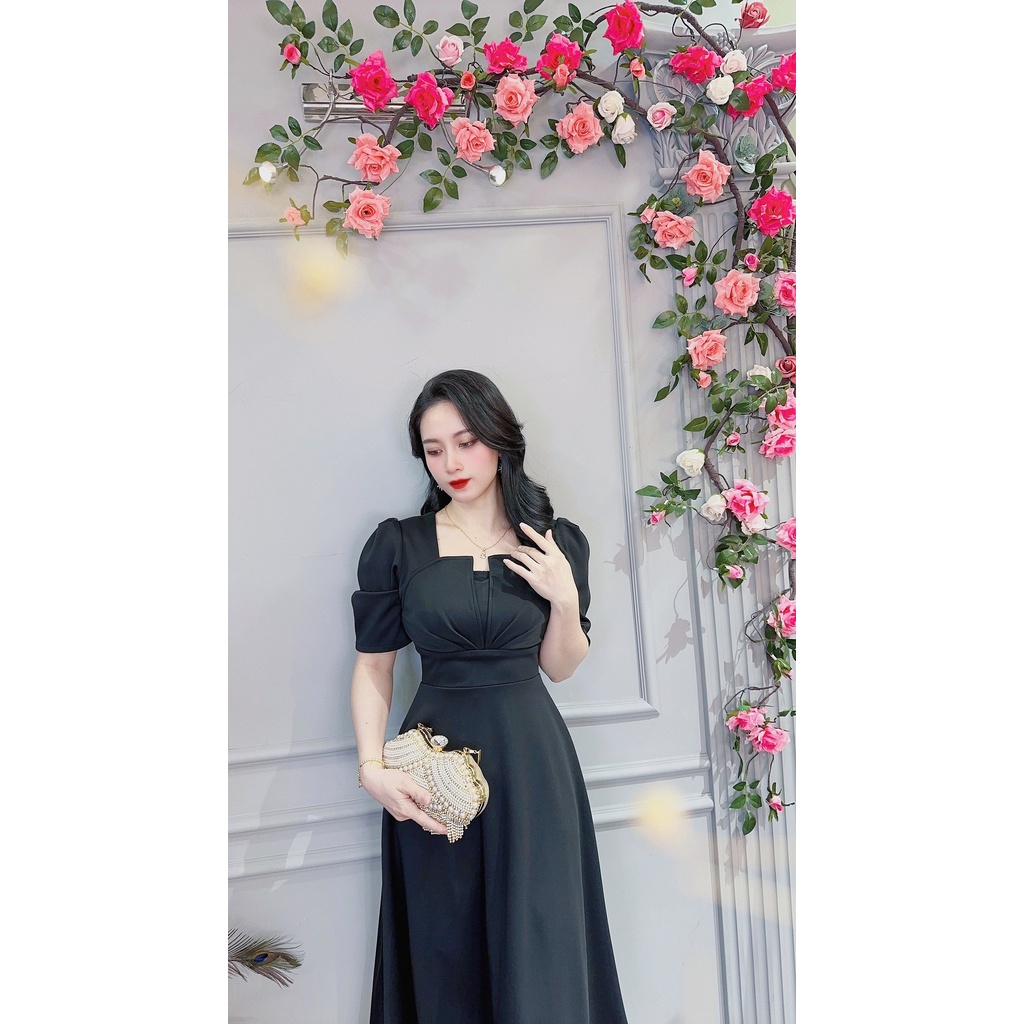 Da1545 . Váy đen xòe. Ngực cách điệu tay phồng. Vải poly co giãn siêu nhiều. Vải dày mềm ko nhăn.