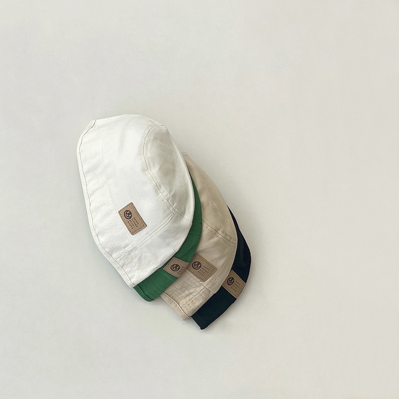 Mũ bucket vành cụp cho bé, gắn tag da ngầu