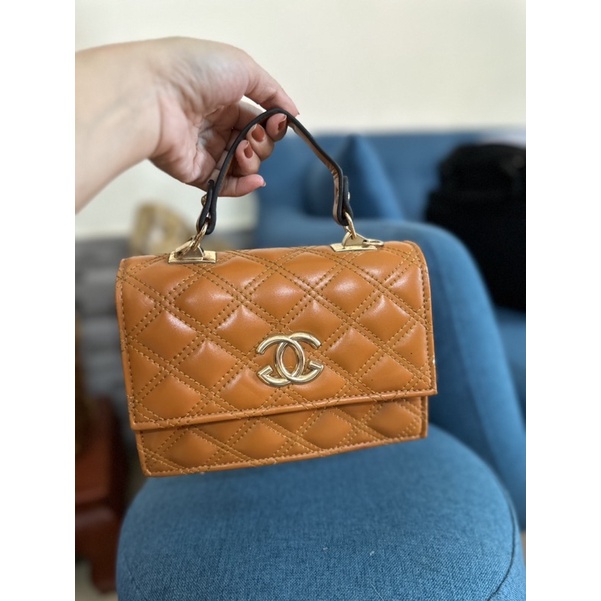 Túi xách cầm tay nữ màu nâu lỗi nhẹ