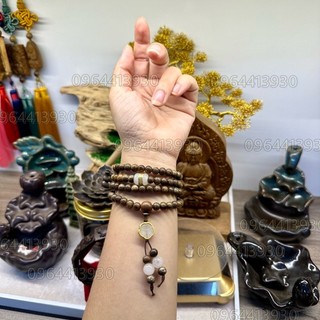 Vòng tay trầm hương quấn tay 6li mix charm lu thống dác v à ng và charm bạch ngọc