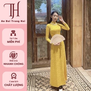 Áo dài truyền thống lụa gấm hoa văn mà vàng nghệ-Trang Hải