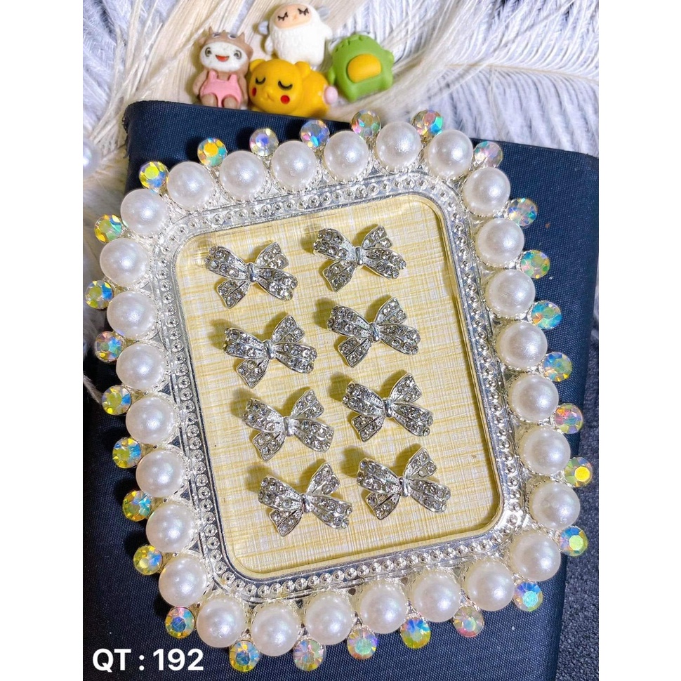 mã charm nơ 2 màu vàng bạc