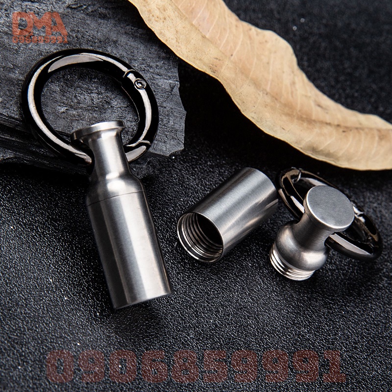 Móc khóa nhộng đựng thuốc titan,ống đựng phụ kiện cứu sinh EDC (C45)