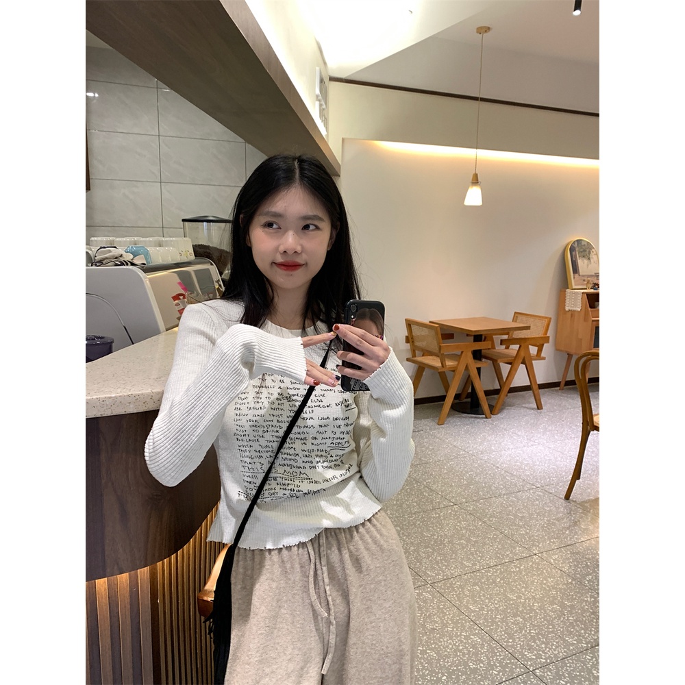 Áo thun nữ tay dài thun gân trắng in nhiều chữ đen áo form rộng/ áo ôm