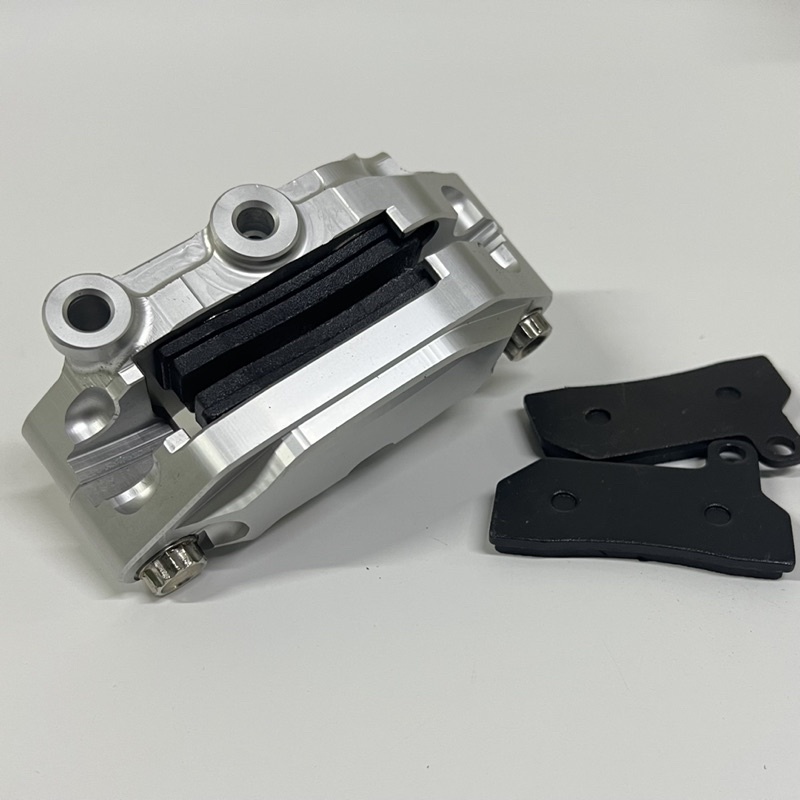 Heo dầu Nissin 4 piston.Tặng thêm 2 má phanh