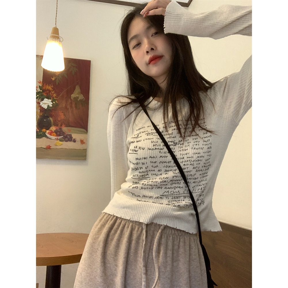 Áo thun nữ tay dài thun gân trắng in nhiều chữ đen áo form rộng/ áo ôm